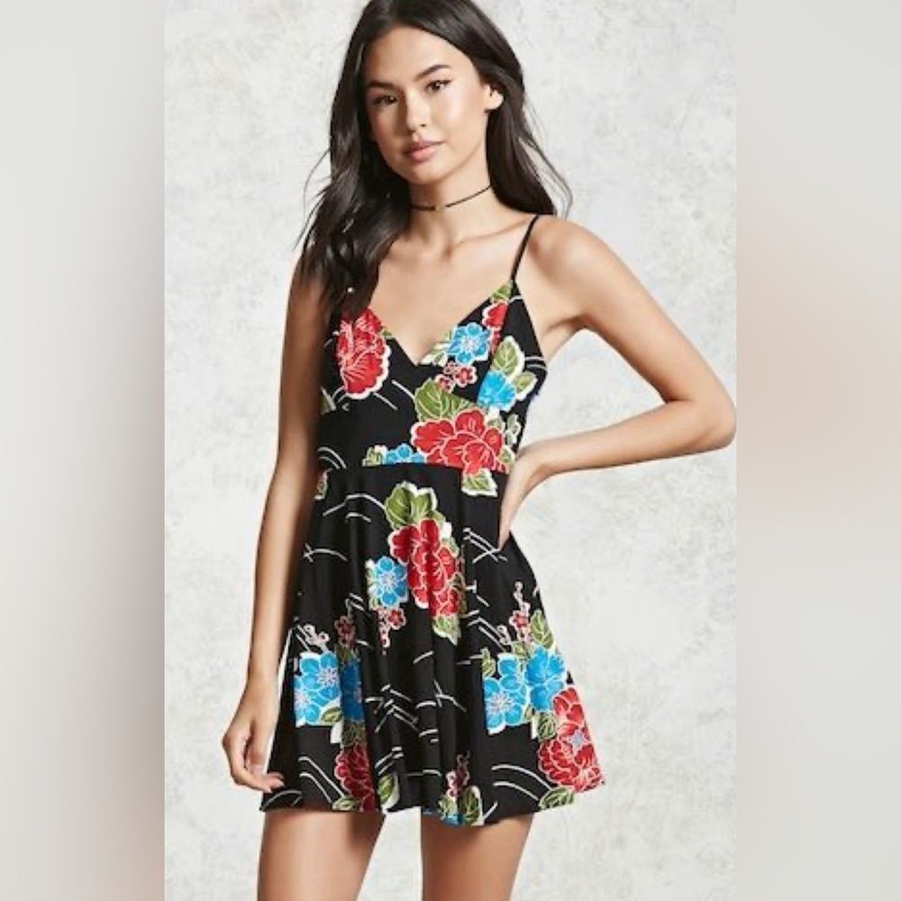 Flirty and fun black floral mini dress size medium